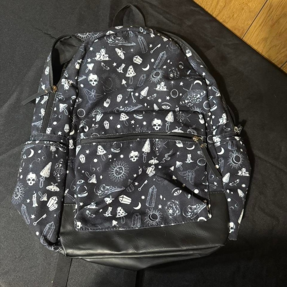 Black and white backpack with skulls, moons, and stars NEW‎